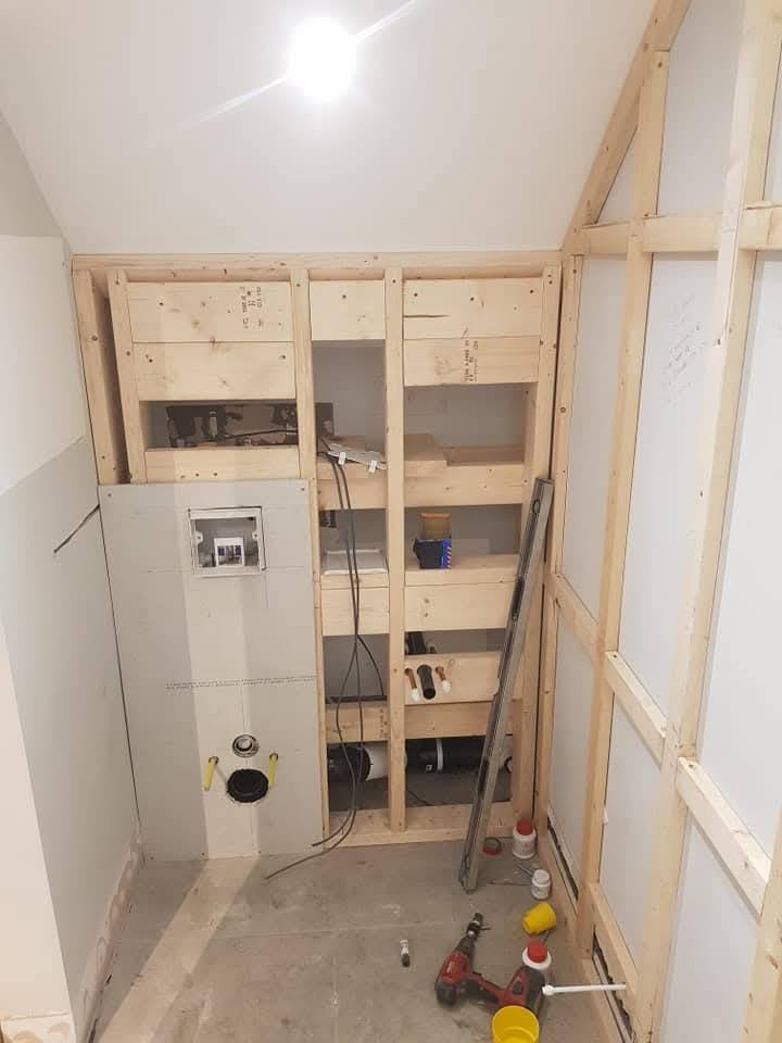 Stud framework with concealed cistern carrier ready for plasterboard